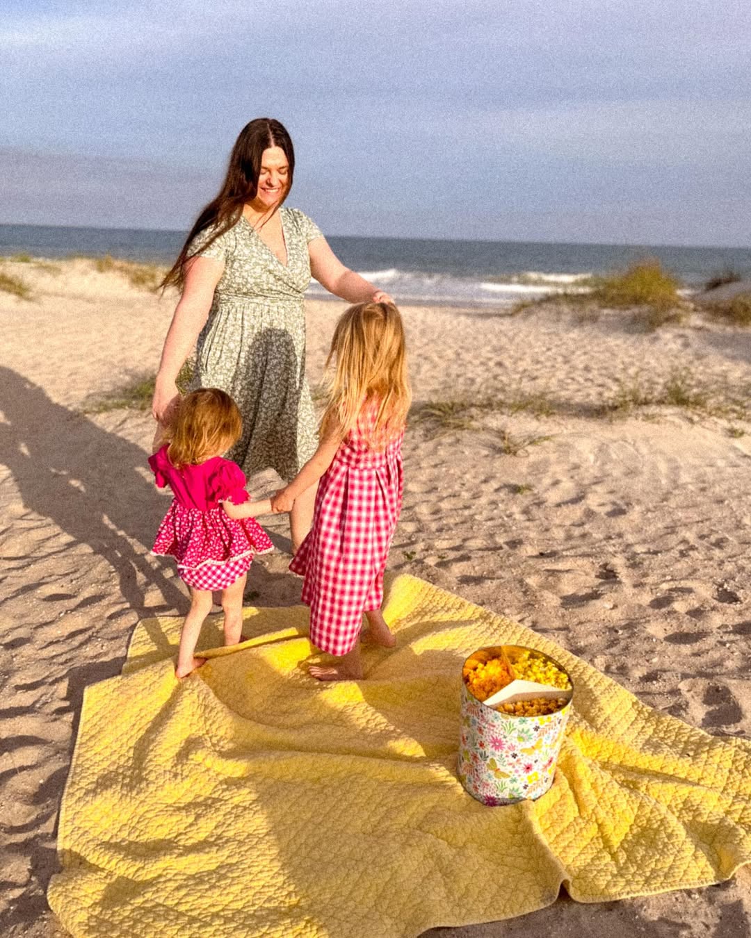 Instagram post by @angielambert15 for The Popcorn Factory. Caption reads: Spring is in the air & we’re having a beach picnic....