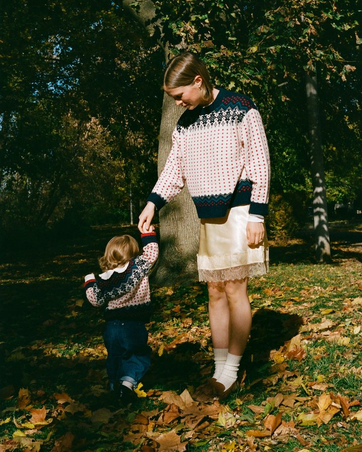 Instagram post by @tessmadalyn for J.Crew. Caption reads: frolicking in the fall leaves wearing @jcrew fair....