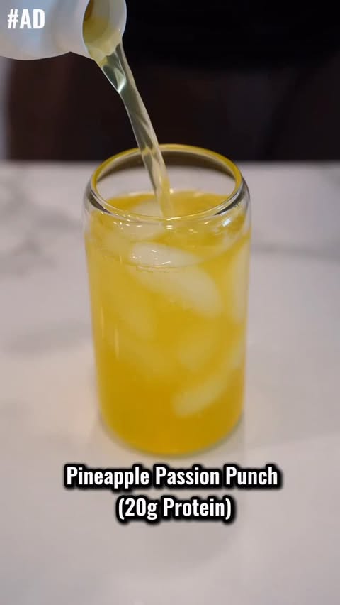 Instagram post by @justinanderson_fit for Dymatize. Caption reads: #Ad Dymatize ISO100 Clear Pineapple Passion Punch....