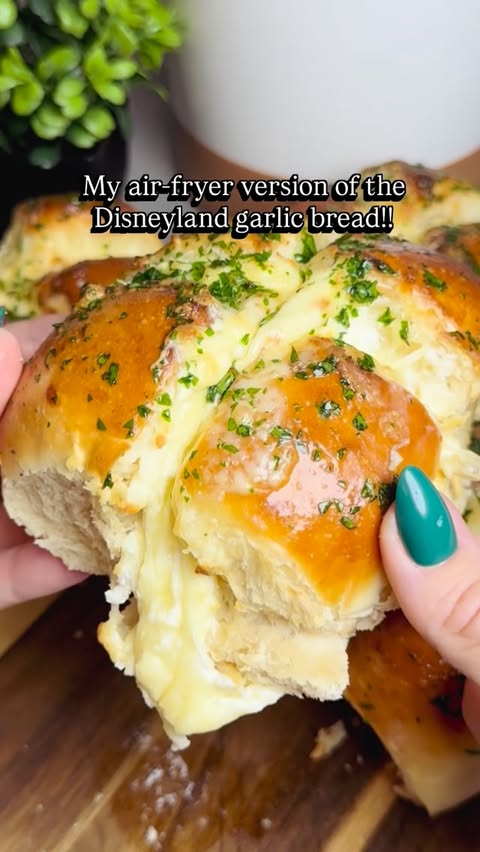 Instagram post by @disneyforfoodies for Disneyland. Caption reads: My air-fryer version of the Disneyland garlic....