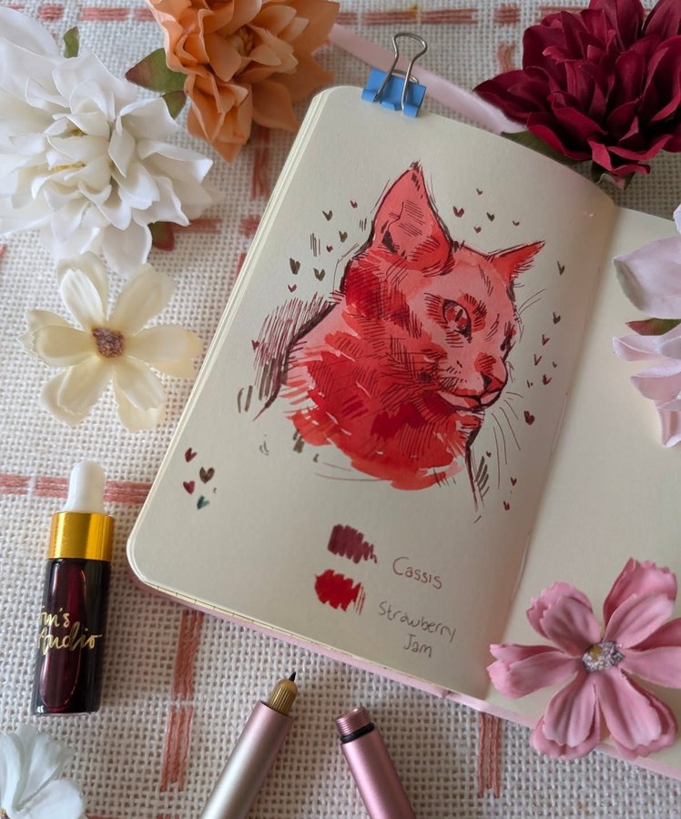 Instagram post by @jenraeart for Toms Studio. Caption reads: [...] cat drawing using the mini inks from....