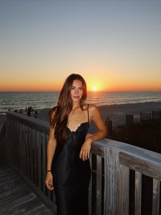 Instagram post by @hallesimons_ for Princess Polly. Caption reads: postcard from paradise 💌.