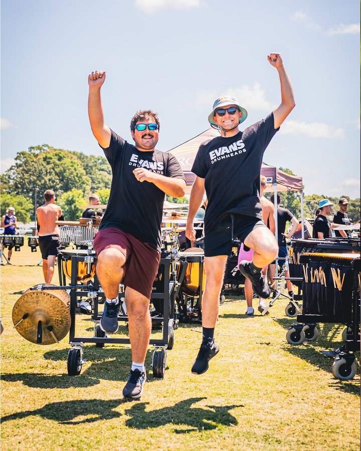 Instagram post by @carolinacrownpercussion for EVANS Drumheads. Caption reads: 📸 Behind the Scenes: EVANS Drumheads Video....