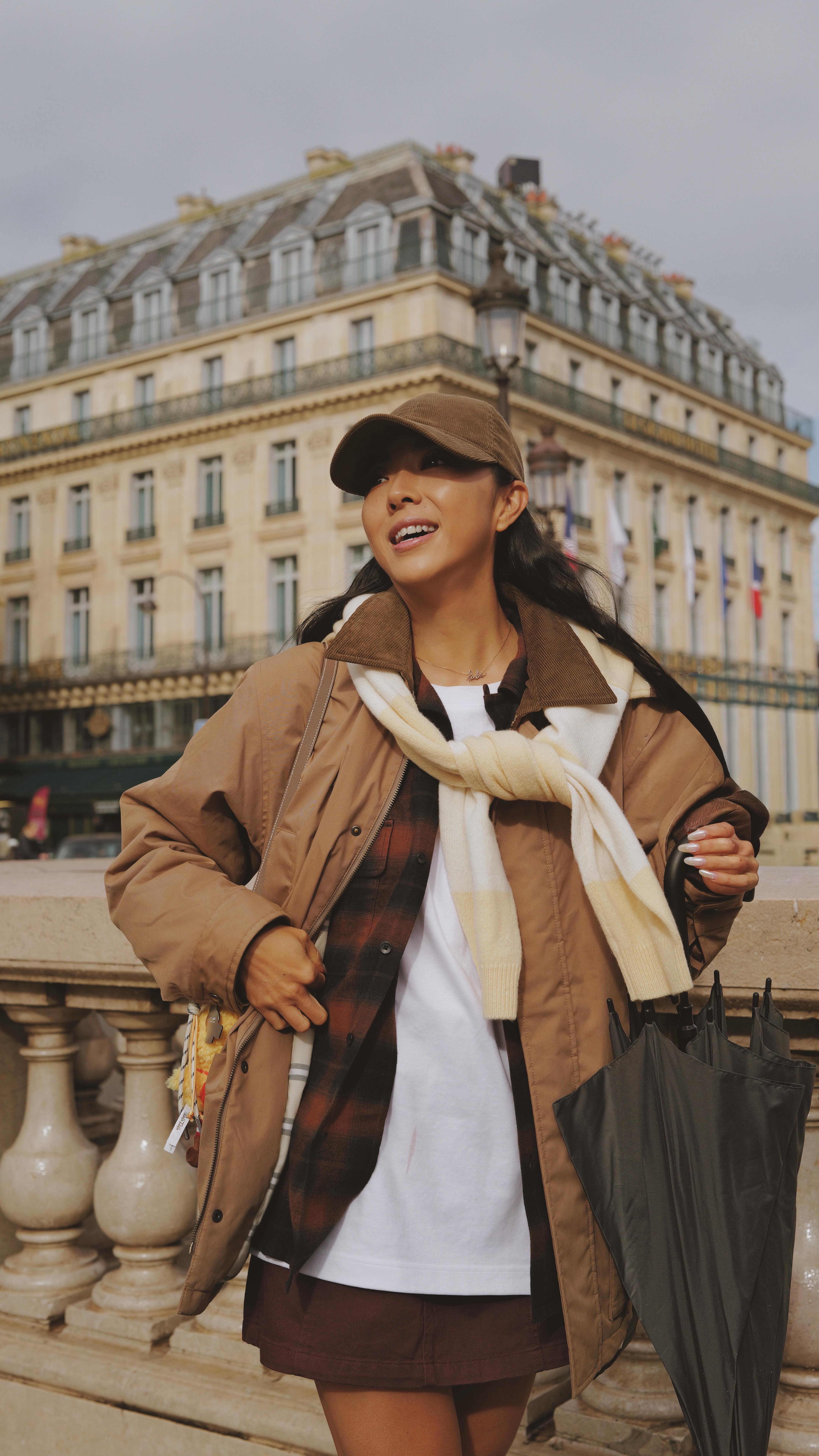 Instagram post by @yuyuzhangzou for JW ANDERSON. Caption reads: Promène à Paris in #uniqlojwanderson @uniqlo....