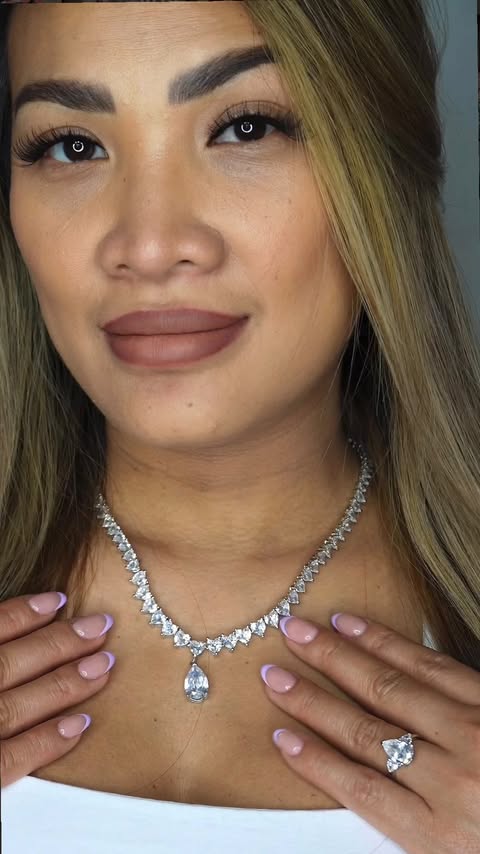Instagram post by @ugcbykhloe for Sayabling Jewelry. Caption reads: A little sparkle moment🎀✨ �wearing the Pear Cut....