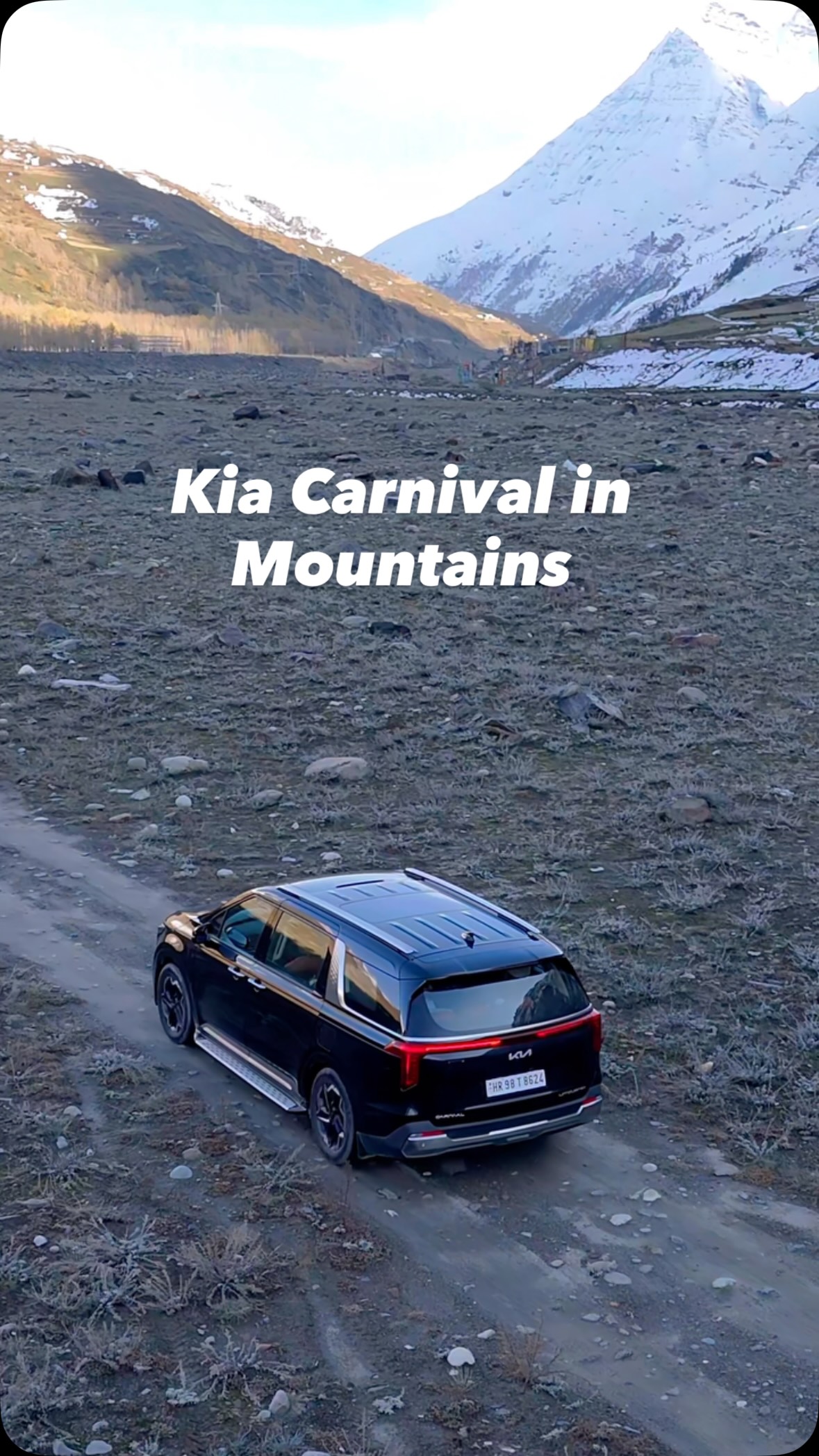 Instagram post by an influencer for Kia India. Caption reads: When comfort and power meet the mountains, magic....