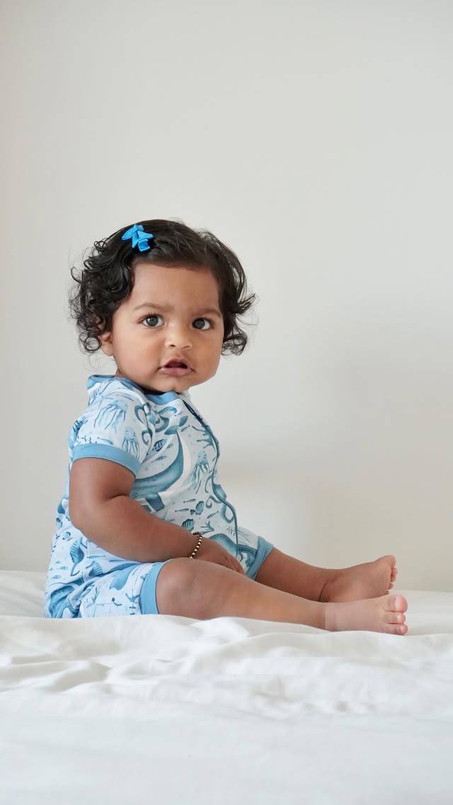 Instagram post by @deepthi.bhat for Dreamland Baby. Caption reads: [...] loves her bamboo romper from....