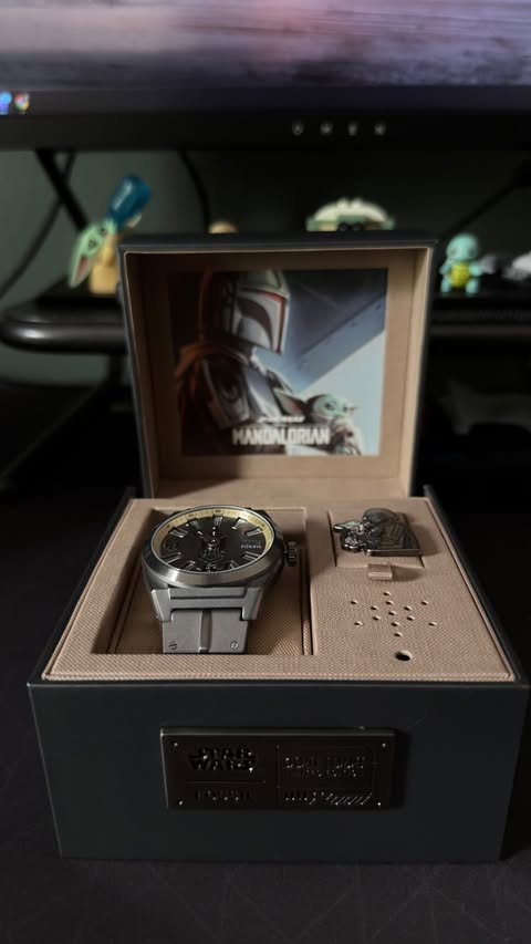 Instagram post by @theroguekeyholder for Fossil. Caption reads: [...] first piece of beskar 🔥😮‍💨 thank you....