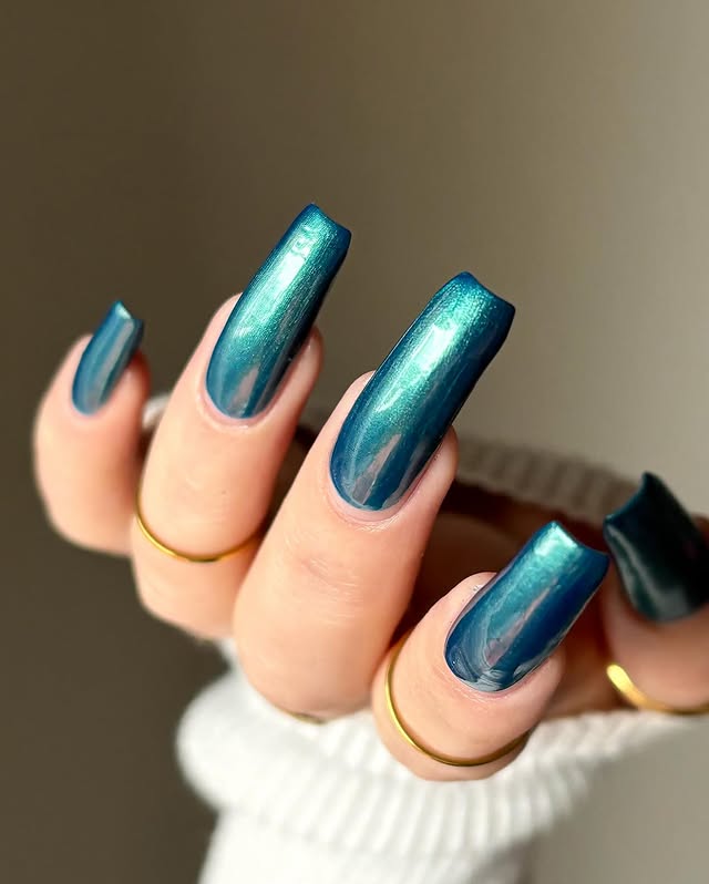 Instagram post by @cozychai.nails for Cracked Polish. Caption reads: Water Your Own Grass - @crackedpolish 💙💧✨ *paid....