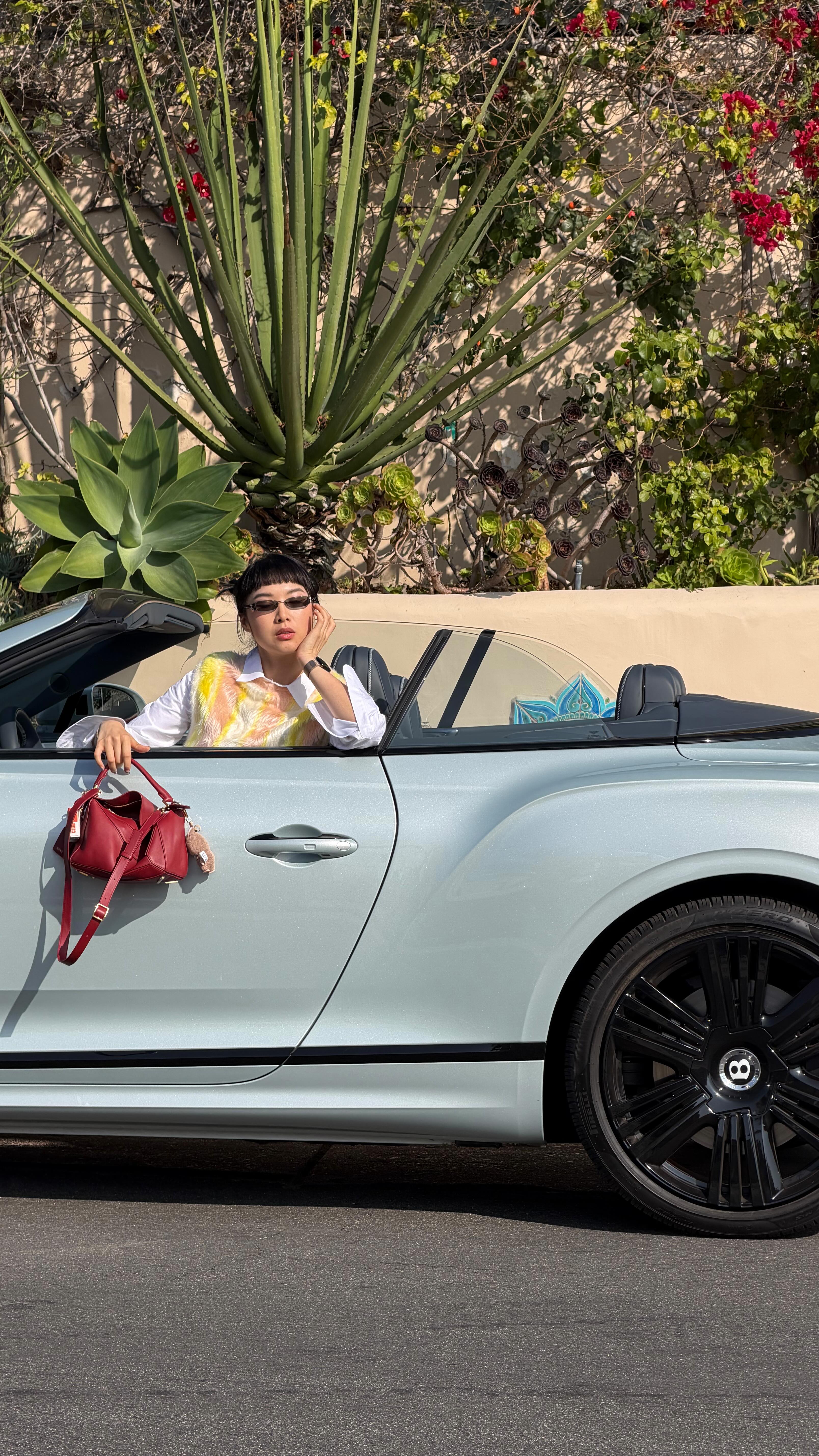 Instagram post by @valslooks for Bentley Motors. Caption reads: [...] I open  the convertible top from my....