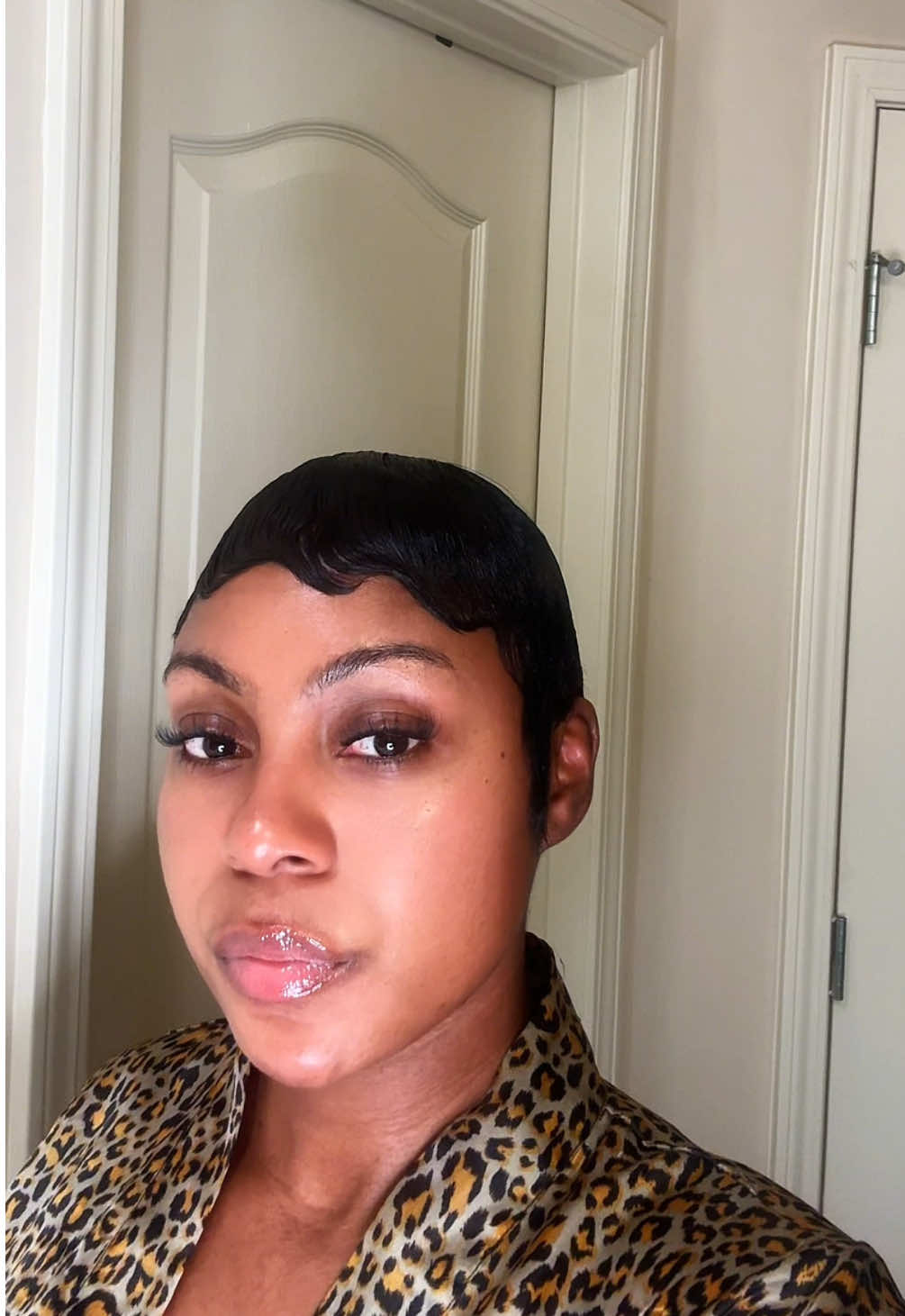 TikTok post by @akilahhaynes for Design Essentials. Caption reads: [...] Professional mousse & sheer shine @Design....