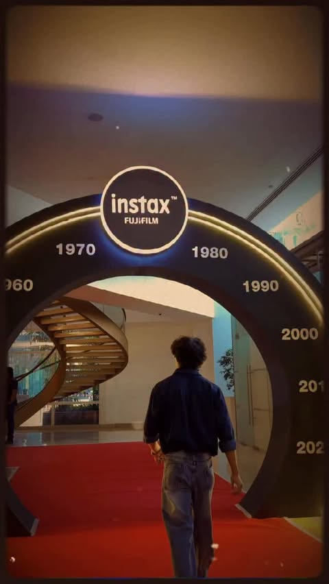 Instagram post by @princee_prt for Instax. Caption reads: Walking through decades with Instax Mini Evo....