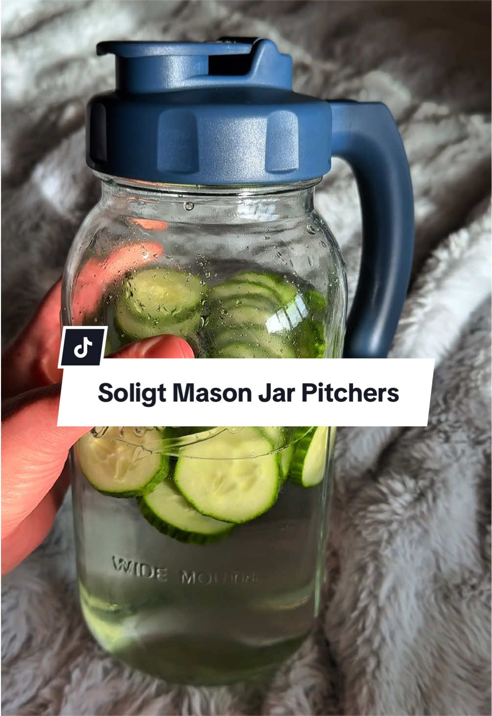 TikTok post by @emilymomfinds for Soligt. Caption reads: [...] this glass pitcher = peak summer energy....