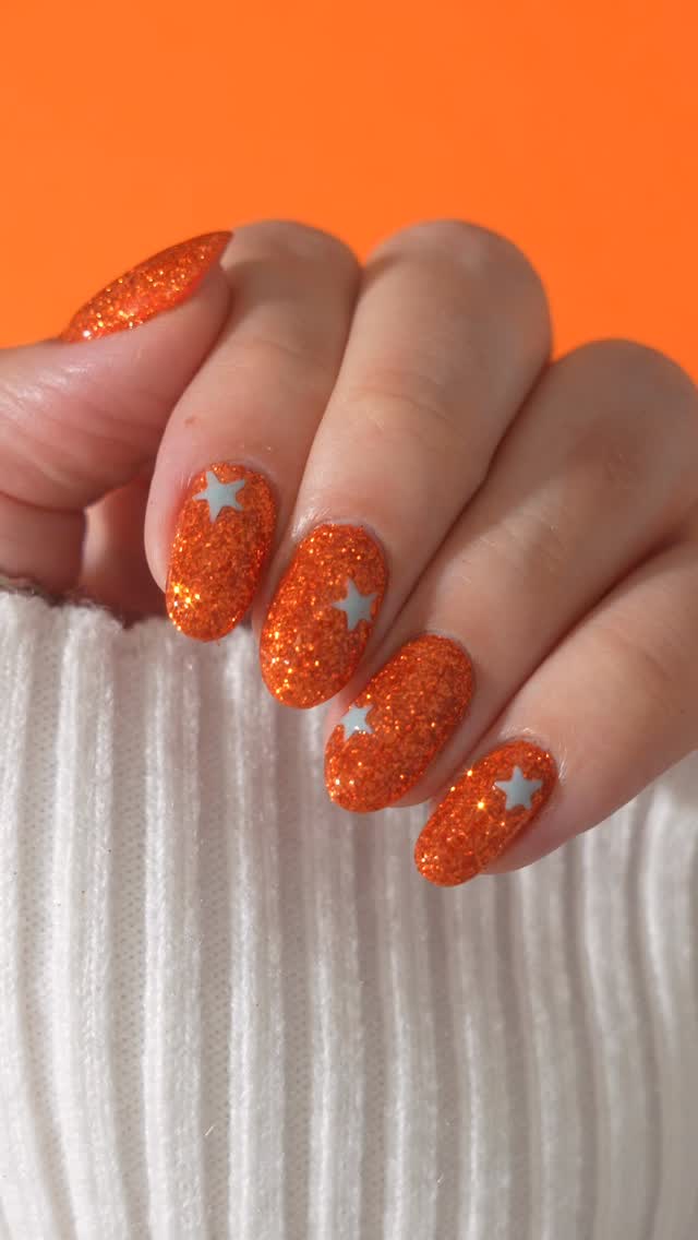 Instagram post by @jauntyjuli for Sally Beauty. Caption reads: ✨ We’re officially in our orange era ✨ Inspired by....