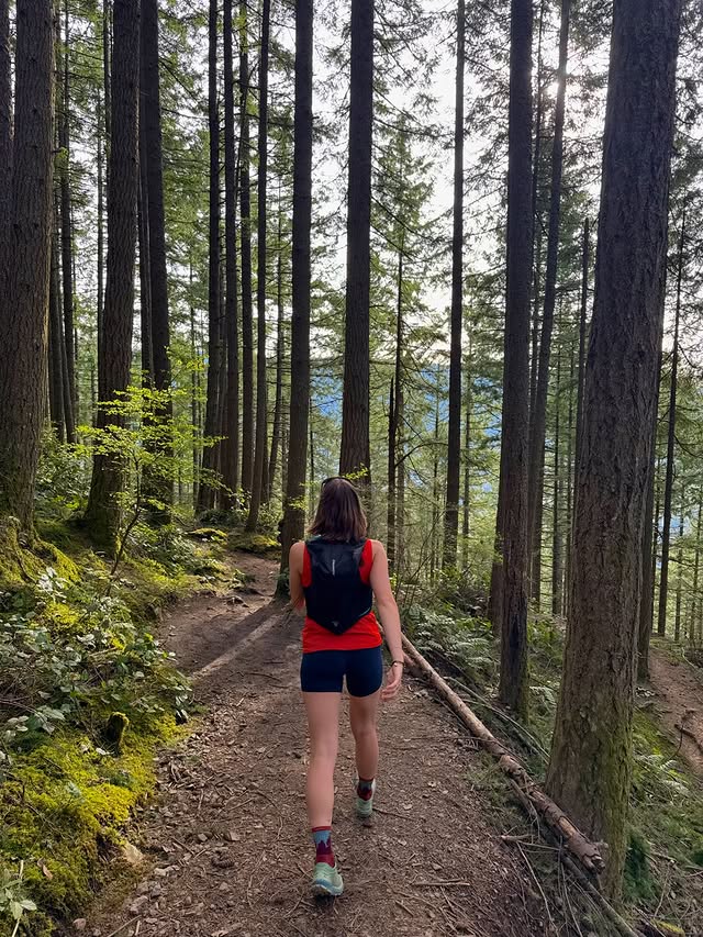 Instagram post by @romanavasyleha for Stio. Caption reads: [...] backyard🌲 in love with my new vest from....