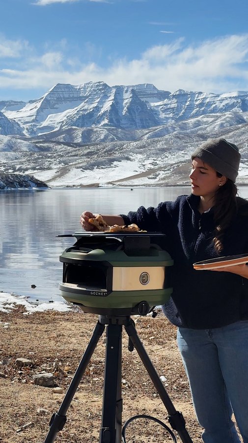 Instagram post by @carolinagelen for Gozney. Caption reads: COOKING AT THE LAKE with @gozney tread launching....