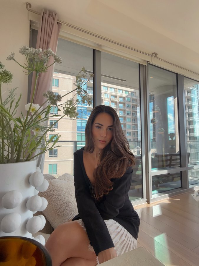 Instagram post by @aneliz_aguilar for REVOLVE. Caption reads: Dressed like I have somewhere to be… even if it’s....