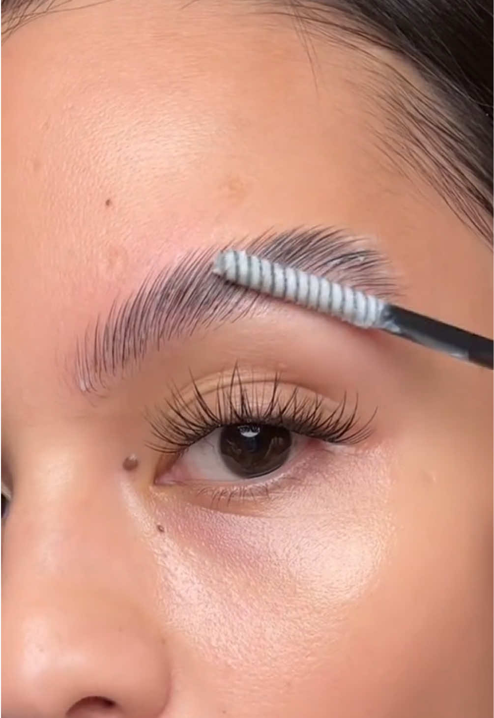 TikTok post by @delacruzmariely for HECI Beauty Makeup. Caption reads: [...] #fluffybrows #brows||@HECI Beauty Makeup.