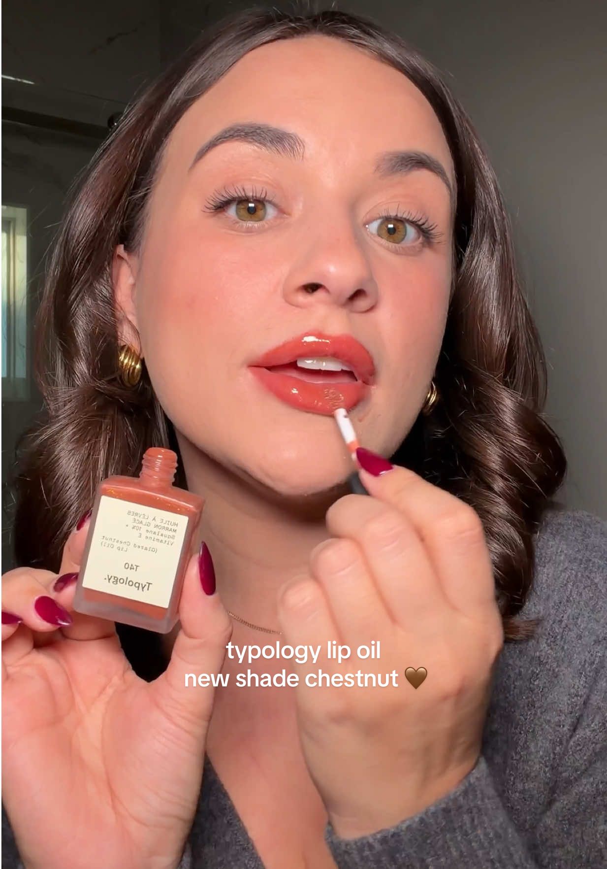 TikTok post by @gabymariie5 for Typology. Caption reads: typology just launched a new lip oil [...].