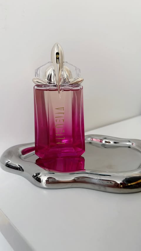 Instagram post by an influencer for MUGLER. Caption reads: Alien PULP by @muglerofficial ✨ Alien PULP the....