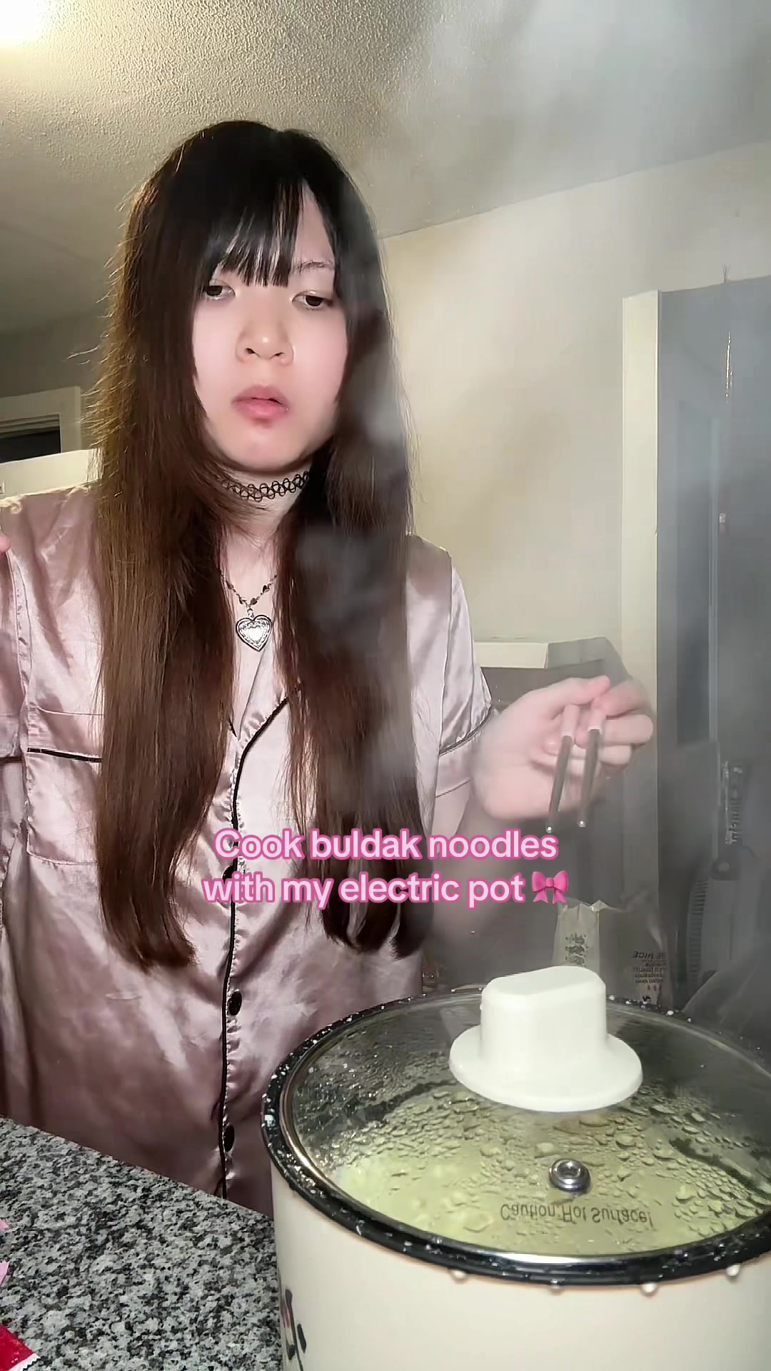 TikTok post by @phokyo for Yami. Caption reads: [...] #vegassteamcookingpot #buldak #carbonara....