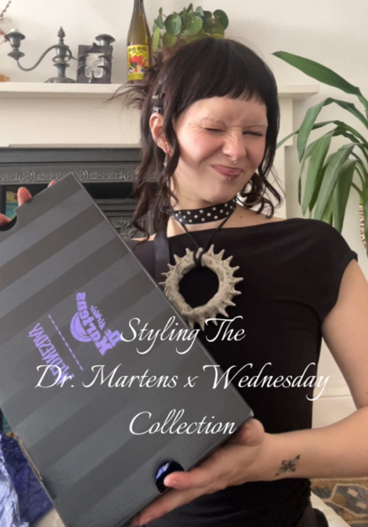 TikTok post by @emsw3rld for Dr Martens. Caption reads: [...] NOW ~ just in time for halloween 🖤 ....