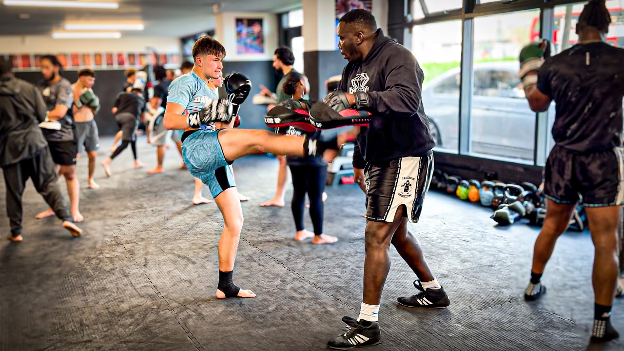 YouTube post by @danielcuttle for XMartial. Caption reads: Training At The World's Most Brutal Muay Thai Gym.