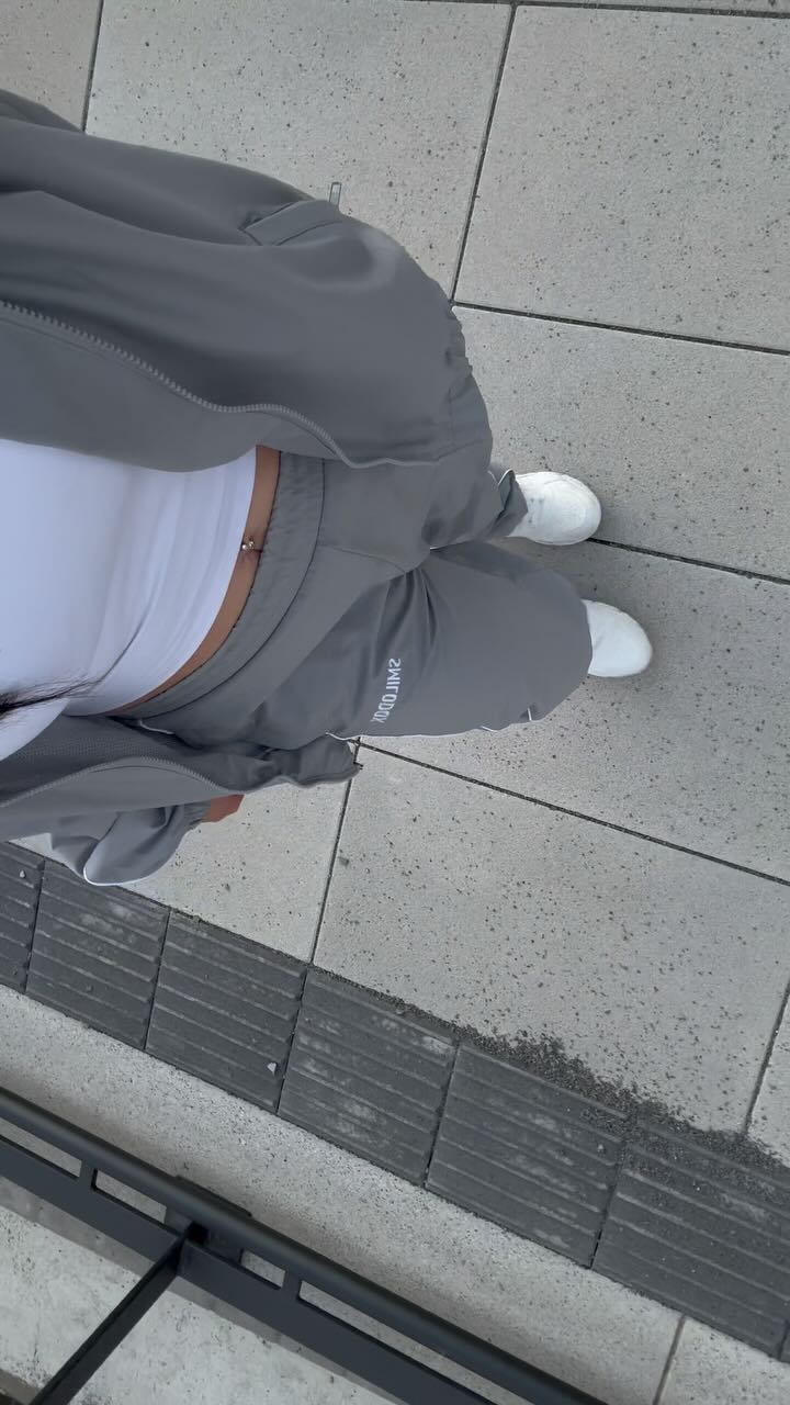 Instagram post by @lauraaantonia for Smilodox. Caption reads: Anzeige | Grey hits different 🩶 

Tracksuit:....