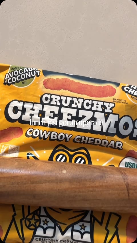 Instagram post by @wholesomelymorgan for LesserEvil Snacks. Caption reads: [...] the cowboy cheddar cheezmos from....