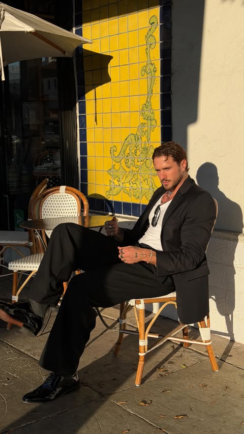 Instagram post by @ashscarrott for Men’s Wearhouse. Caption reads: In my “James Bond takes a stroll” era....