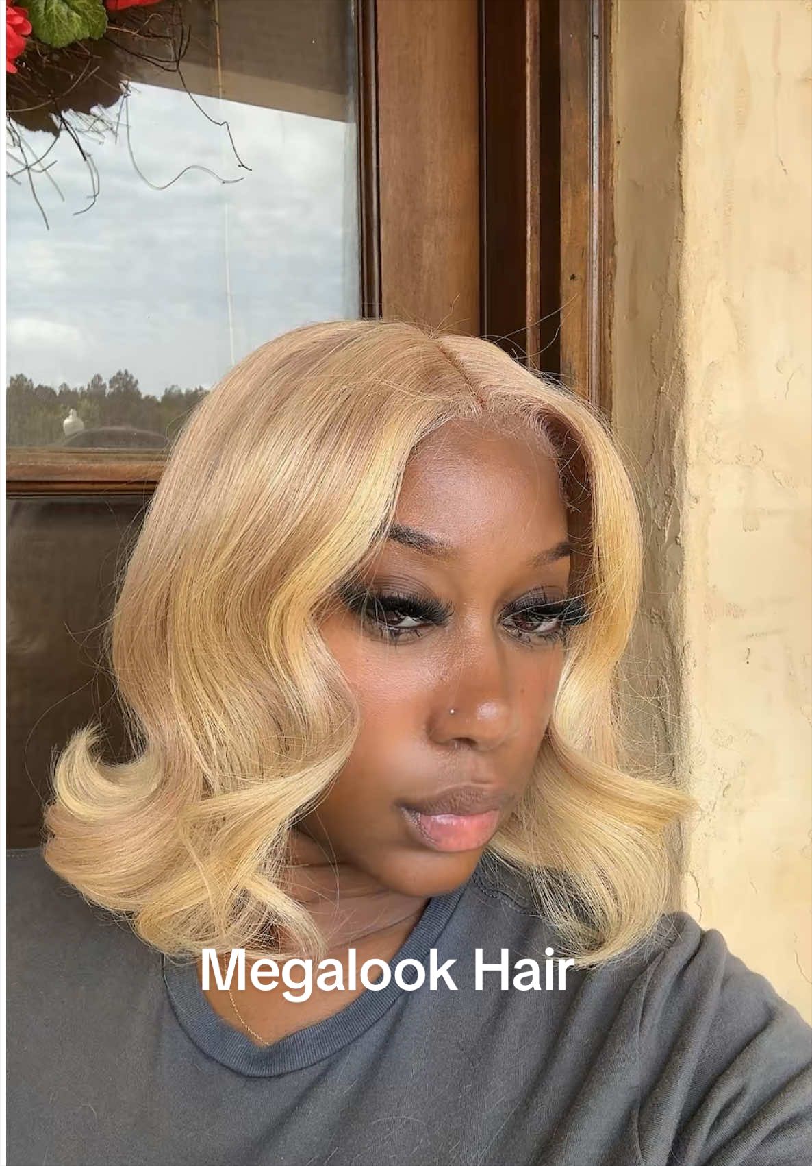 TikTok post by @_nursebaemel for Megalook. Caption reads: [...] blonde bob becomes the moment ✨....
