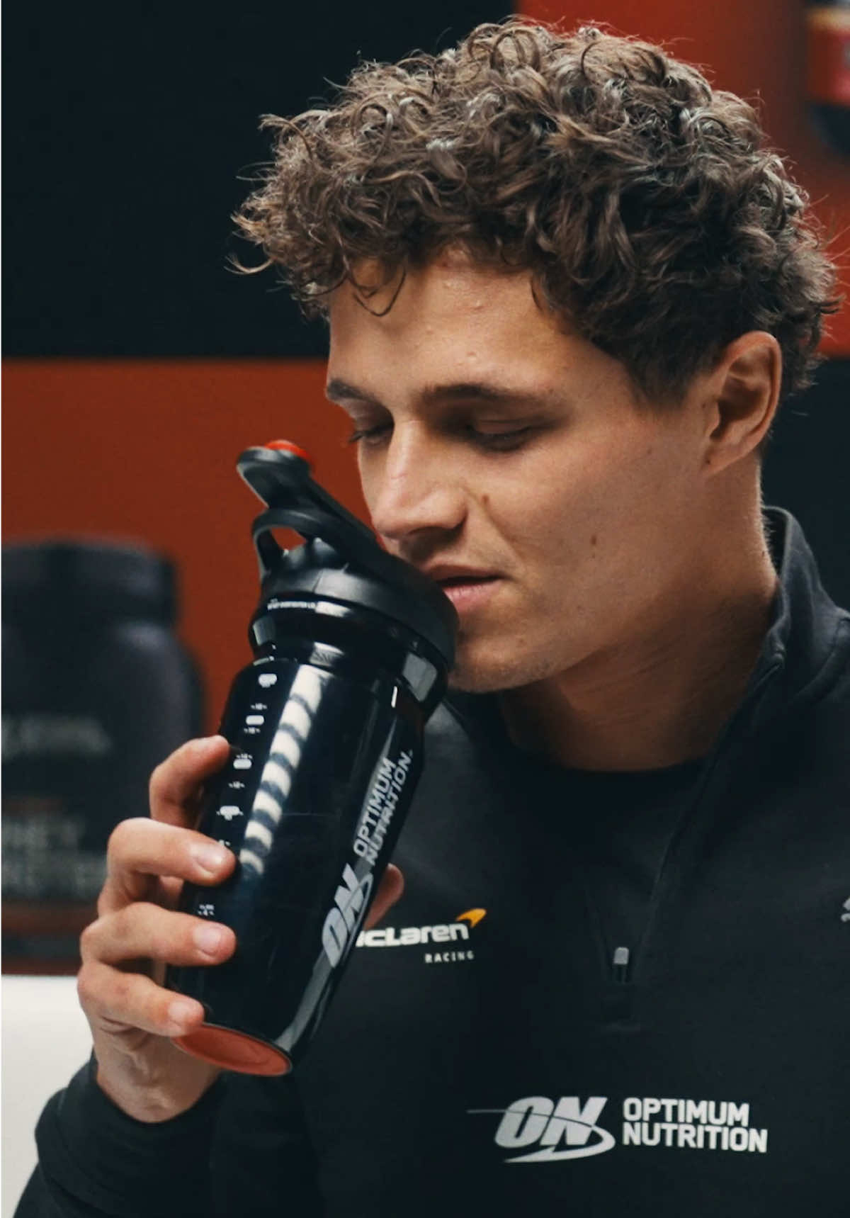 TikTok post by @optimumnutrition_uk for McLaren. Caption reads: [...] anymore… Get the Optimum Advantage @McLaren....