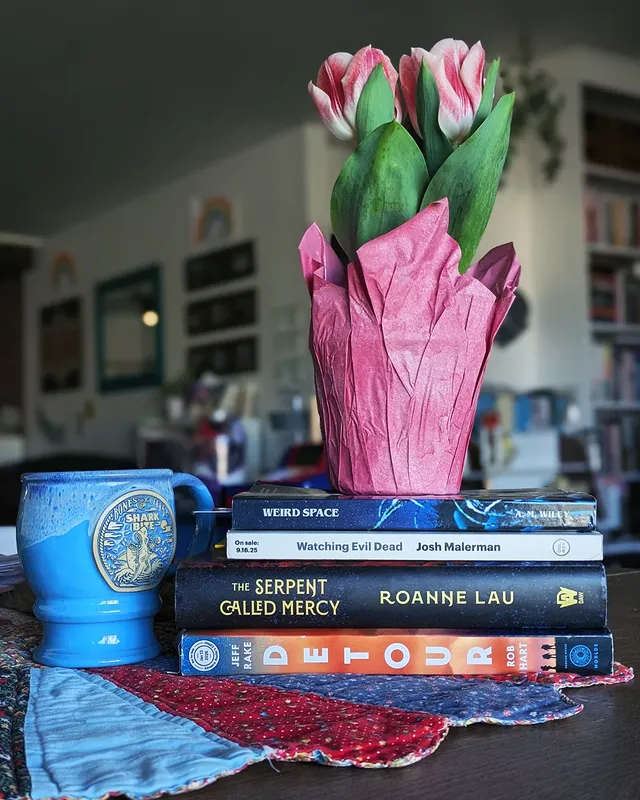 Instagram post by @interview.with.a.reader for Bones Coffee Company. Caption reads: ❔Do you ever take a stupidly long time to finish a....