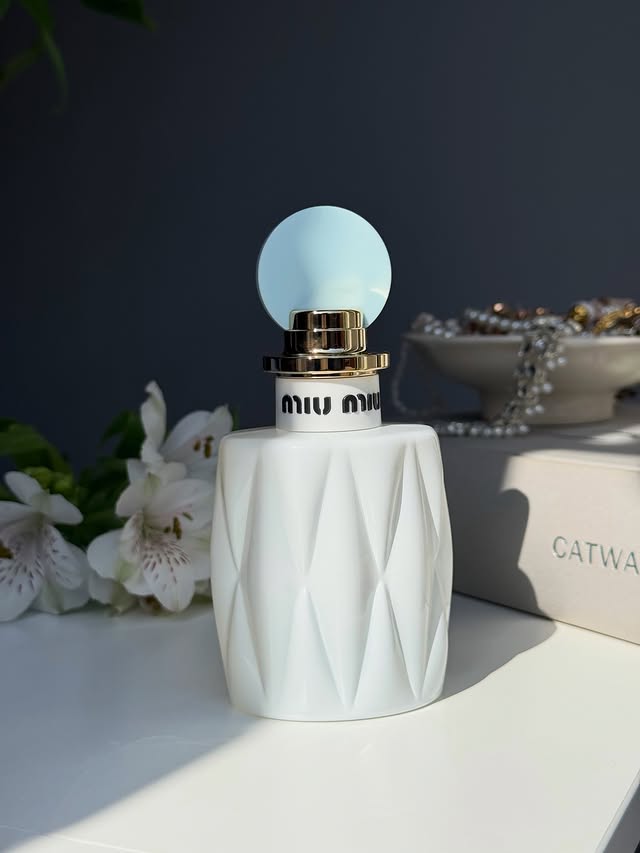 Instagram post by @razs.beautycorner for The Perfume Shop. Caption reads: [...] Available to buy from @miumiu....