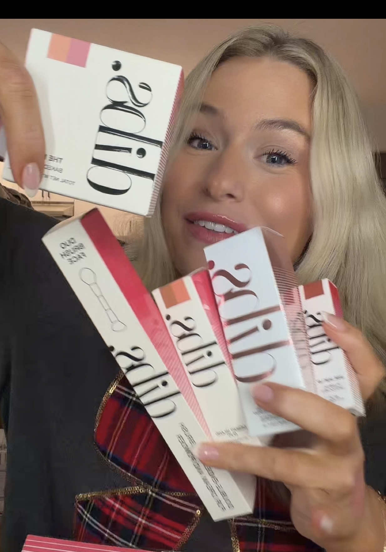 TikTok post by @alexisleianna for DIBS Beauty. Caption reads: DIBS Beauty Holiday Merry Makeover Kit just....