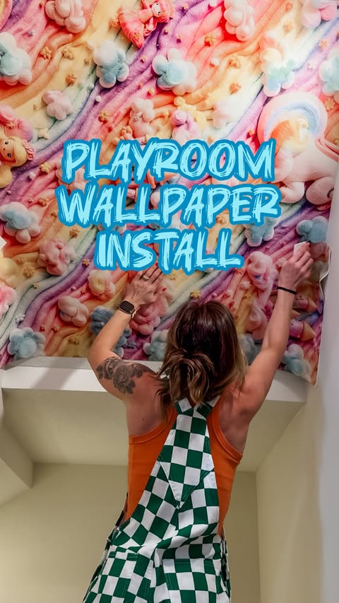 Instagram post by @homewithember for Wallblush. Caption reads: The playroom wallpaper is up and just look at how....