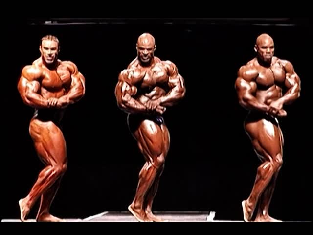 Instagram post by @ironnhistoryy.bodybuildingg.2 for FLEX Magazine. Caption reads: 1999 British Grand Prix…one of the deadliest....