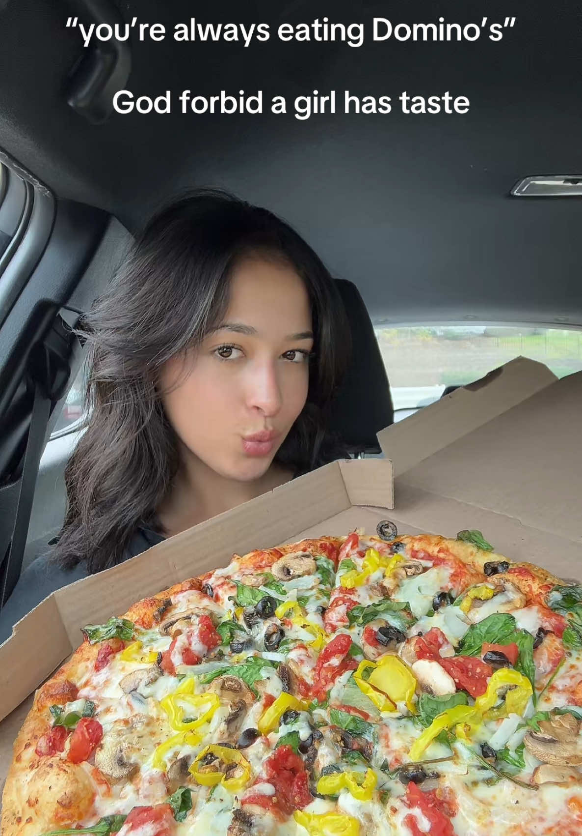 TikTok post by @sanaaeats for Domino Pizza. Caption reads: #ad just a girl and her @Domino’s pizza 😍🍕....