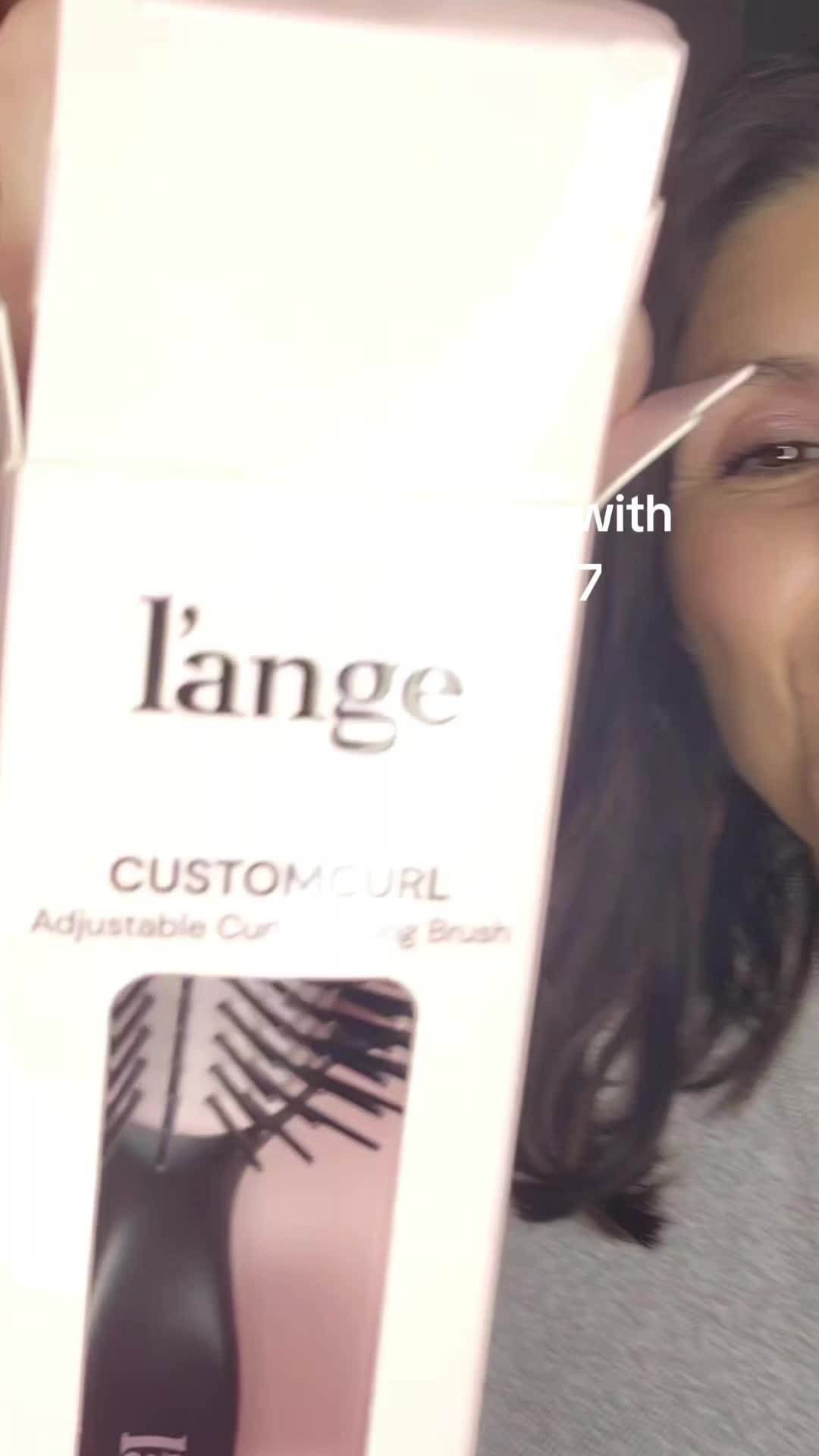 TikTok post by @tired.as.a.mother.4 for L’ange Hair. Caption reads: [...] 10% off with code LANGVIP17 @langehair....