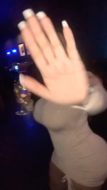 Instagram post by @tracyylopezz for AMICLUBWEAR. Caption reads: This song 🥰😍💕 @amiclubwear.