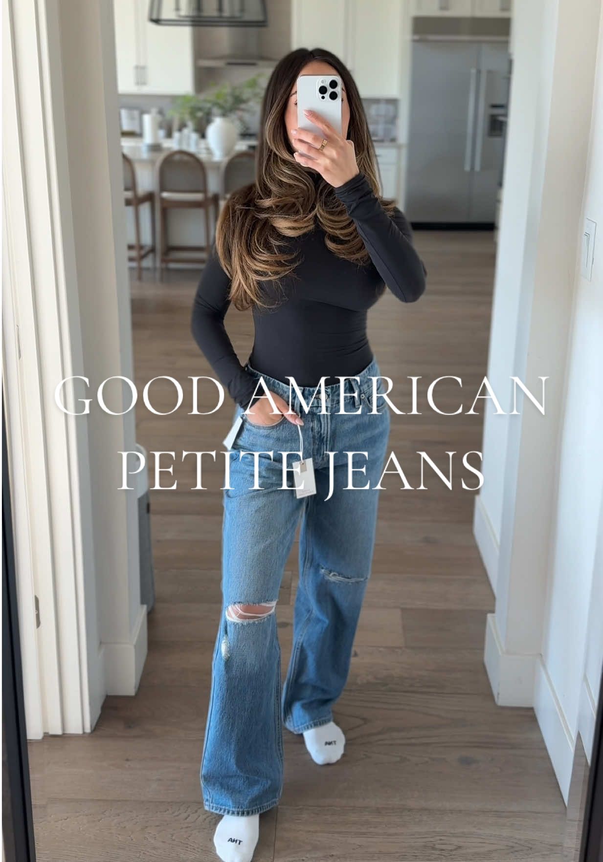 TikTok post by @briannametzger1 for GOOD AMERICAN. Caption reads: Good American 90s relaxed jeans > Wearing a size....