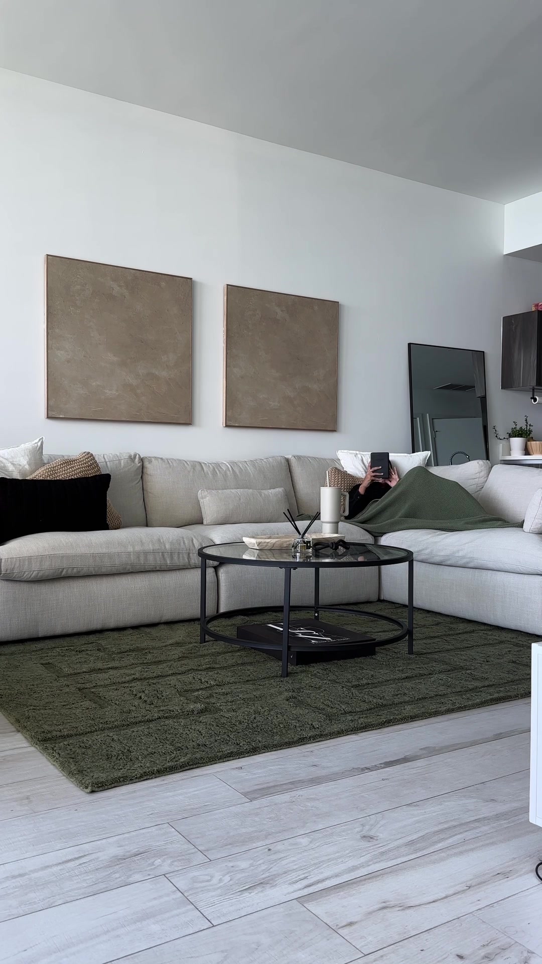 TikTok post by @quepasoyaya for Revival Rugs. Caption reads: [...] living room together with @Revival 🖤....