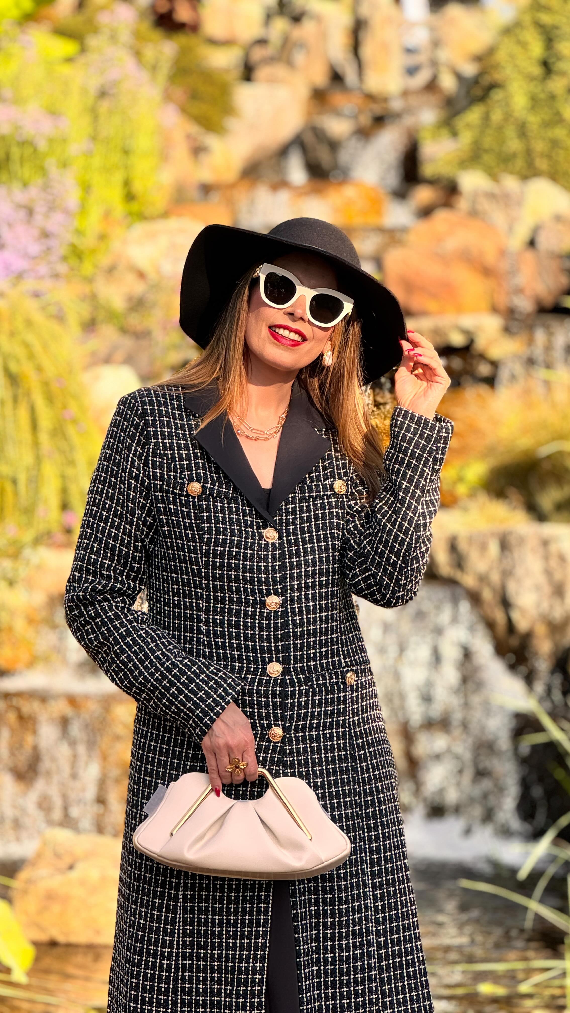 Instagram post by @official.vineeta_fashion for JW PEI. Caption reads: Wrapped in tweed and autumn’s golden hour....