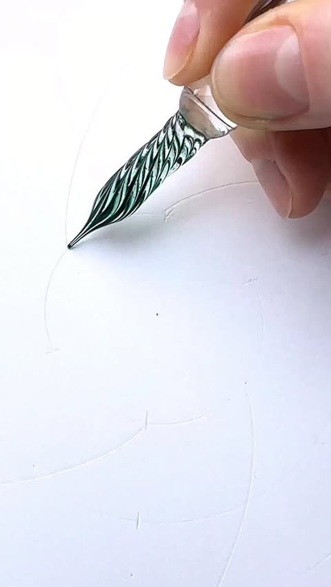 Instagram post by @alena_light for Ferris Wheel Press. Caption reads: Drawing a mandala with a crystal dip pen is a....