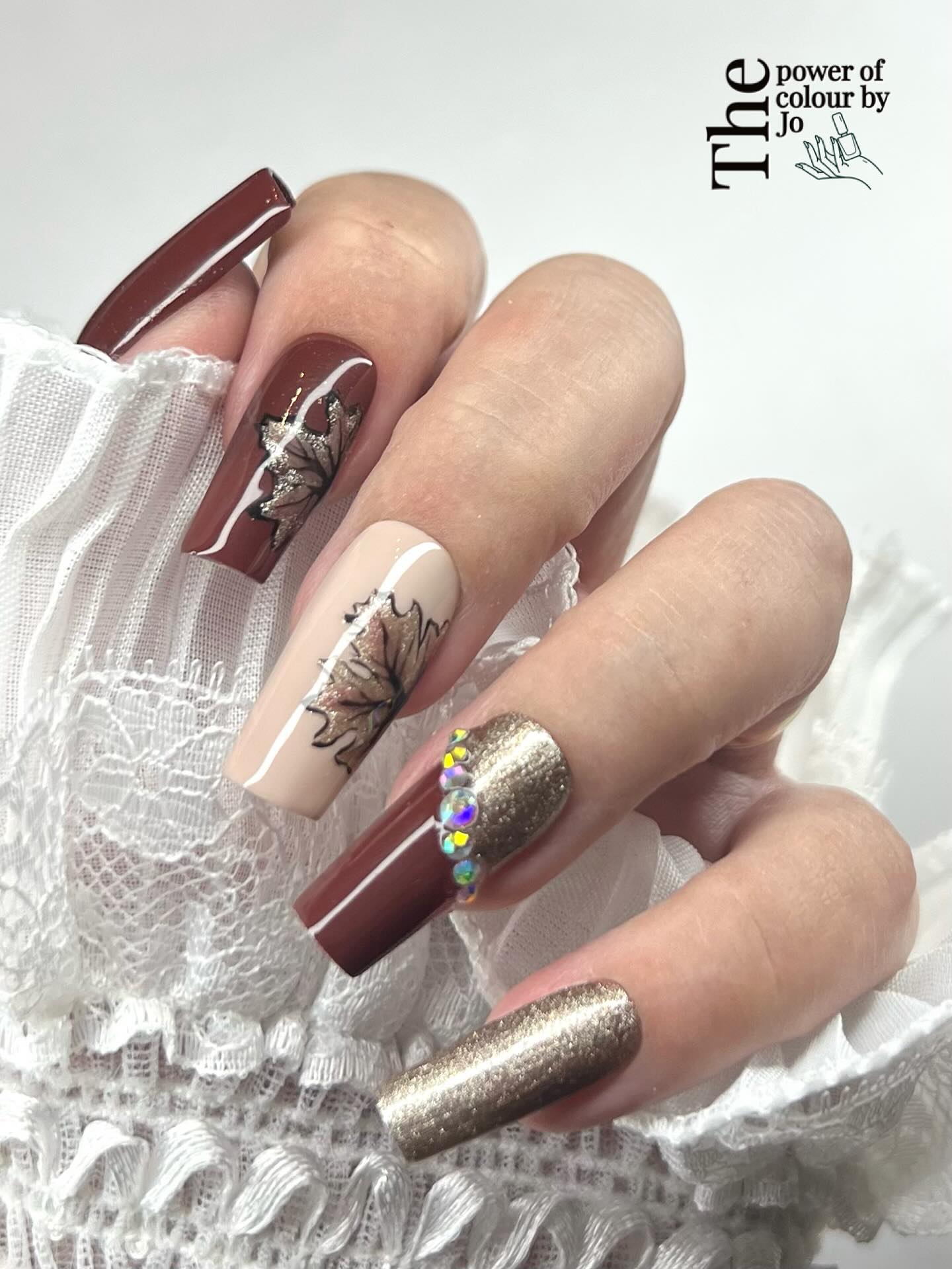 Instagram post by @the_power_of_colour_by_jo for Madam Glam. Caption reads: Fall nail inspiration: gems because I'm extra,....