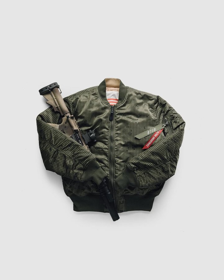 Instagram post by @qilotactical for Alpha Industries. Caption reads: Reversible MA-1 Bombers in collaboration with....