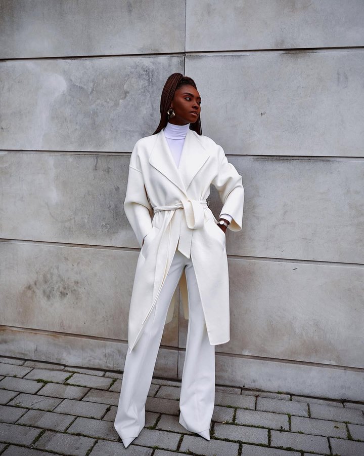 Instagram post by @gezellerenee for SKAGEN. Caption reads: One coat - multiple ways but always with....