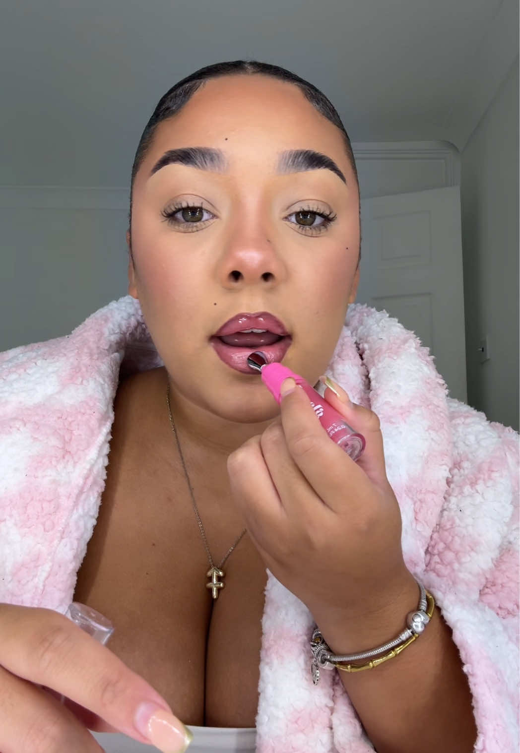 TikTok post by @shinyefinds for Give Me Cosmetics. Caption reads: These lip oils are unreal @Give Me Cosmetics....