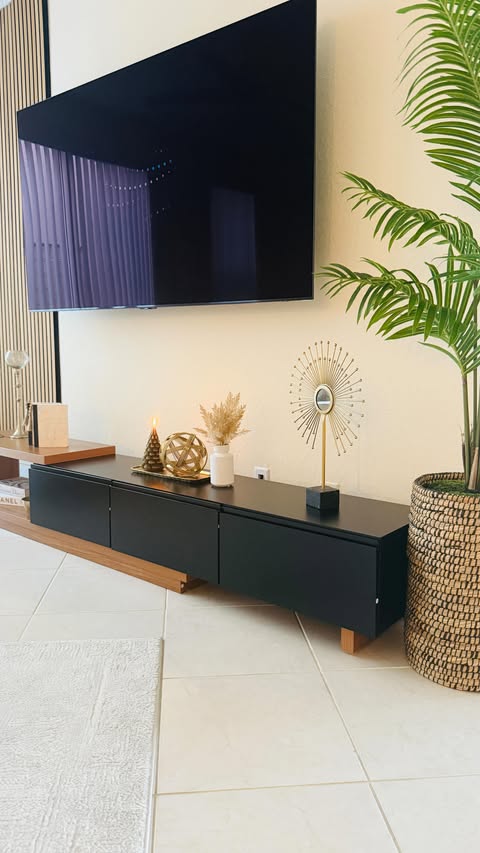 Instagram post by @velyanayurekli for Homary. Caption reads: Transforming my living room with this gorgeous TV....