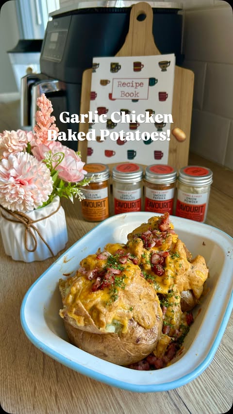 Instagram post by @eimers_eats for Favourit Foods Ltd. Caption reads: Garlic Chicken Baked Potatoes using some of....